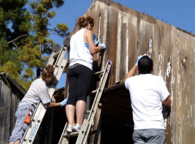 photo of workers maintaining a cabin